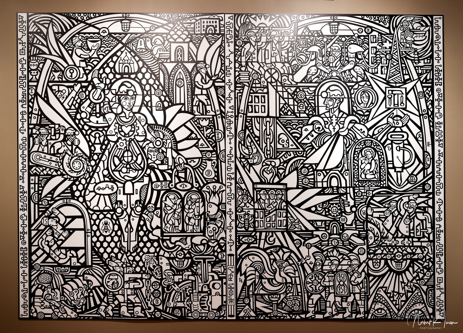 a mural depicting miners and workers combines Ukrainian folkart woodcut with Soviet era socialist realism